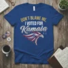 Blue t-shirt with gold and silver text reading "DON'T BLAME ME, I VOTED FOR Kamala" above a patriotic eagle graphic