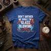 T-shirt with white text "DON'T BOTHER ME WHILE I'M GLASS BLOWING unless you brought beer" with colorful graphics and beer
