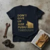 Dark navy t-shirt with gold distressed text "DON'T GIVE UP JUST PUSH THROUGH" and a stick figure pushing a rock