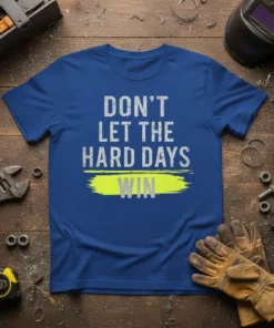 Blue t-shirt with "DON'T LET THE HARD DAYS WIN" text in distressed white and yellow design