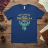 Don't Make Me Use My Guatemalan Voice quote with green eagle graphic on a blue t-shirt