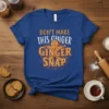 Blue t-shirt with "DON'T MAKE THIS GINGER GINGER SNAP" text and a grumpy gingerbread man graphic
