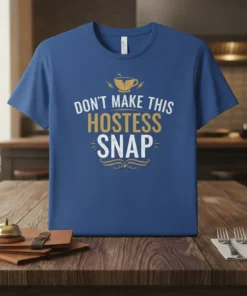 T-shirt with the text "Don't Make This Hostess Snap" in white and gold, featuring a cracked coffee cup graphic