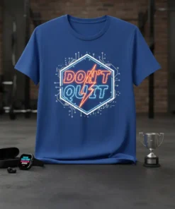 Bold neon "DON'T QUIT" text within a hexagonal frame on a blue t-shirt, with circuit board graphics
