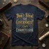 Navy t-shirt with distressed gold and white text reading "Don't Steal THE GOVERNMENT Hates COMPETIIION" in decorative font