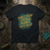 Black t-shirt with yellow and blue text saying "DON'T STOP LETTING PEOPLE NOT HELP" with circuit board and gear graphics