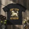 Don't Stop Retrievin' Golden Retriever graphic t-shirt with paw prints and playful dog illustration