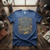 DON'T TELL ME WHAT TO DO YOU'RE NOT MY Daughter quote on a blue t-shirt with ornate golden floral border