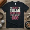 Black t-shirt with "DON'T TELL ME WHAT TO DO YOU'R NOT MY DOG" text and paw print graphics