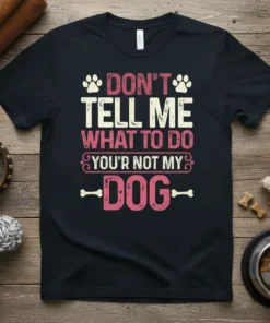 Black t-shirt with "DON'T TELL ME WHAT TO DO YOU'R NOT MY DOG" text and paw print graphics