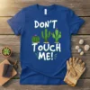 T-shirt with "DON'T TOUCH ME!" text and three cartoon cacti, green on royal blue shirt