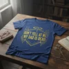 Don't Yell At Me My Dad Is Dead quote in distressed gold font on a navy blue t-shirt with wing