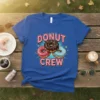 Blue t-shirt with "Donut Crew" text and three colorful donuts in the center