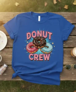 Blue t-shirt with "Donut Crew" text and three colorful donuts in the center