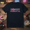 Donut Interrupt Me quote with pink donut graphic on a navy blue t-shirt, showcasing a sweet treat theme