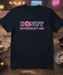 Donut Interrupt Me quote with pink donut graphic on a navy blue t-shirt, showcasing a sweet treat theme