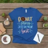 Blue t-shirt with "DONUT stress JUST DO YOUR best" text and a donut graphic