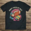 Donut Touch My Ball text with football and donut graphic on a black t-shirt