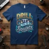Drill 'TT' Til It Squirts funny quote t-shirt with gear and pipe graphics