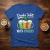 St. Patrick's Day t-shirt with "Drinks Well WITH OTHERS" text and three beer mugs graphic