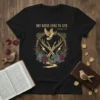 Black t-shirt with "Dry Bones Come To Life Ezekiel 37:1-10" text, skeleton hands, dove, roses, and lightning bolts graphic