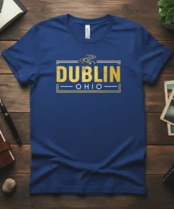 Dublin Ohio text graphic t-shirt in navy blue, with distressed gold lettering and a wavy road design above the city