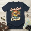 Duck, Duck Cruise t-shirt design featuring a cartoon duck in a hammock on a cruise ship, with palm trees and