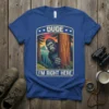 DUDE I'M RIGHT HERE Bigfoot peeking from behind a tree graphic on a blue t-shirt, forest sunset background, outdoor theme
