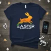E.A.STER BUNNY RIDES text with a running bunny graphic on a navy t-shirt, perfect for Easter