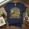 Vintage graphic tee with text "Easily Distracted By Cats & Plants" featuring a cat among potted plants