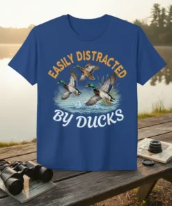 T-shirt design with text "Easily Distracted By Ducks" and graphics of mallard ducks in flight over water