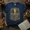 Navy t-shirt with gold text "EAT DIRT AND DIE TRASH" featuring a portrait of Marie Antoinette and skulls