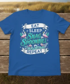 Eat Sleep Snag Spoonbill Repeat text with flamingo-like birds and fish graphics on a blue t-shirt