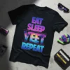 Eat Sleep Yeet Repeat text in retro gradient font with a sunset beach graphic, on a black t-shirt