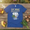 Eat What Elephants Eat t-shirt design featuring a happy elephant eating vegetables with bold text