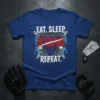Eat. Sleep. Headbang! Repeat. text with skull and guitar graphics on a blue t-shirt, suitable for heavy metal fans