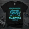 Black t-shirt with glowing blue diagram of a video game controller and the text "EDUCATION IS IMPORTANT BUT GAMING IS