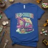 EGGS-CAVATOR text above a pink excavator loading Easter eggs into a basket, on a blue t-shirt