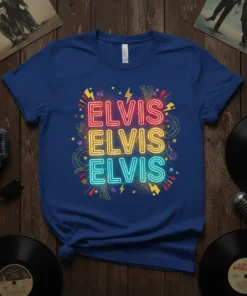 Blue t-shirt with "ELVIS ELVIS ELVIS" in stacked neon lettering in pink, yellow, and teal, surrounded by colorful stars and