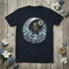 Enjoy The Journey text on a dark t-shirt with a celestial yoga mandala design featuring a sun and moon