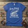 Even Jesus Had A Fish Story quote on a blue t-shirt with a jumping fish graphic