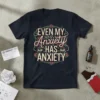 T-shirt with the bold quote "EVEN MY Anxiety HAS ANXIETY" in decorative lettering, featuring stylized eyes and roses