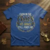 Christian t-shirt with the quote "Even In The Chaos His Grace Still Finds Me" in decorative typography and cross graphics