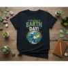 T-shirt featuring the text "everyday is EARTH DAY!" with a smiling cartoon Earth graphic, surrounded by green leaves