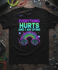 Black t-shirt with "EVERYTHING HURTS AND I AM DYING" text and a neon digital rainbow graphic