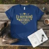 Blue t-shirt with gold glitter text "EX-BOYFRIEND MATERIAL" and lightning bolt graphics