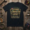 Black t-shirt with "Exterior Illumination Expert Even The Little Lights Will Twinkle" text and colorful Christmas lights graphic