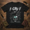 F-CAW-F text design with a black crow on a skull, surrounded by roots and plants, on a black t-shirt