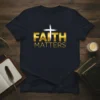 Navy t-shirt with gold "FAITH MATTERS" text and a white cross graphic, featuring a Christian theme