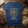 Family Historian Genealogy Tree T-Shirt in navy blue with gold design. Features text "Genealogy" and "Family Historian" with a tree